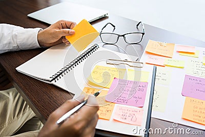 Businessman working with note paper for brainstorming ideas.strategy marketing planning process.research data information Stock Photo