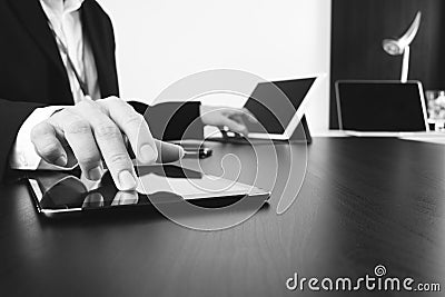 businessman working with smart phone and digital tablet and laptop computer in modern office,balck and white Stock Photo