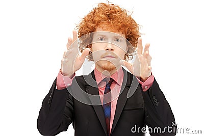 Businessman working with something imaginary Stock Photo