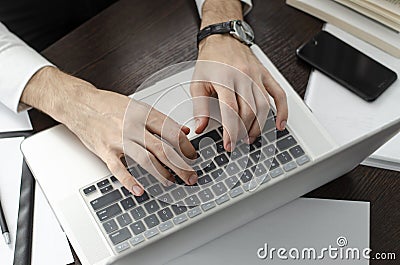 Businessman working in workplace.Stylish man in shirt and tie. Stock Photo