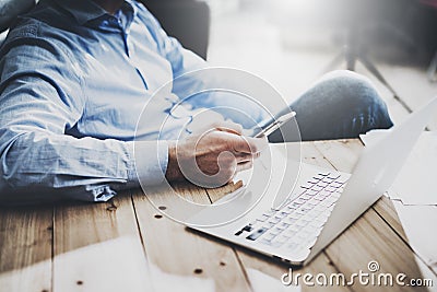 Businessman on workspace. Texting message smartphone. Generic design notebook wood table. Horizontal mockup. Stock Photo