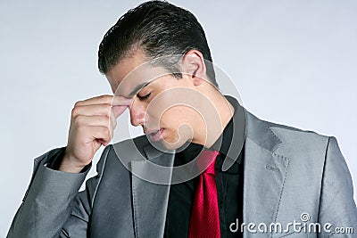 Businessman worried headache stressed and sad Stock Photo