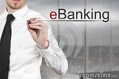 Businessman writing eBanking in the air Stock Photo