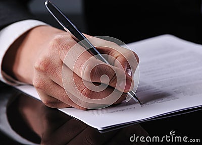 Businessman writing on a form Stock Photo