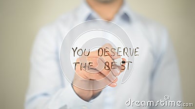 You Deserve The Best , man writing on transparent wall Stock Photo