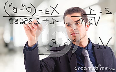 Businessman writing math Stock Photo