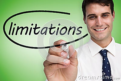 Businessman writing the word limitations Stock Photo