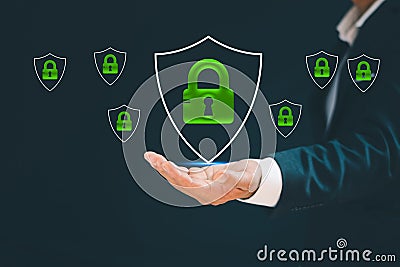 Businessman& x27;s hand showing cyber security protection shield icon. Data security and encryption Securely access user personal Stock Photo