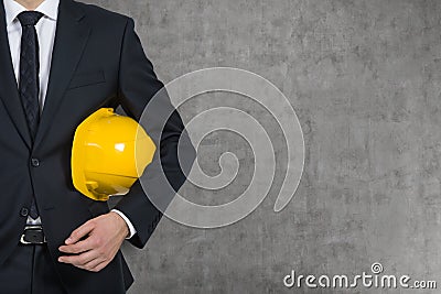 Businessman with yellow hard hat Stock Photo