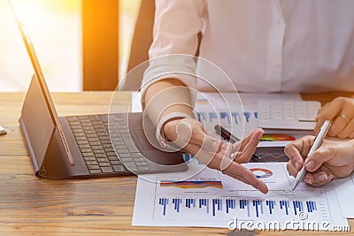 Businessmen and business advisors are discussing past results to improve and fix their investments to make their business better. Stock Photo