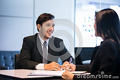 Businessmen and Businesswomen discussing documents for job interview concept Stock Photo