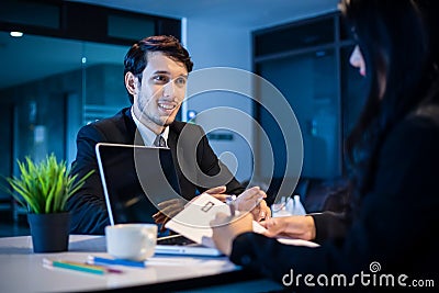 Businessmen and Businesswomen discussing documents for job interview concept Stock Photo