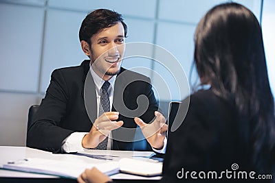 Businessmen and Businesswomen discussing documents for job interview concept Stock Photo