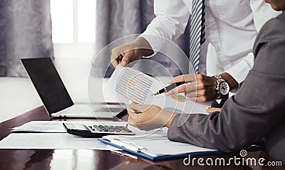 businessmen and businesswomen team meeting to plan strategies to increase business income. Have a brainstorming graph analysis and Stock Photo