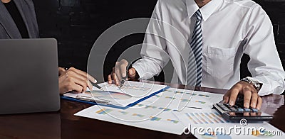 businessmen and businesswomen team meeting to plan strategies to increase business income. Have a brainstorming graph analysis and Stock Photo