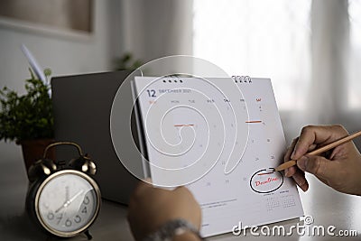 Businessmen are circled on December 31st, the last day of the year Stock Photo