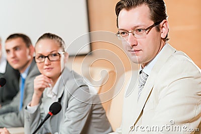 Businessmen communicate at the conference Stock Photo