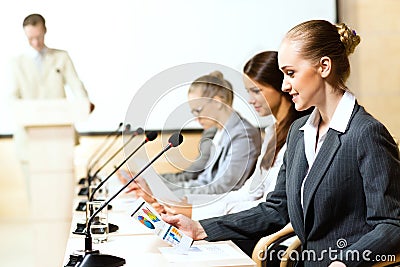 Businessmen communicate at the conference Stock Photo