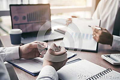 Businessmen explain about quarterly results with colleagues and entrepreneurs and are discussing future financial planning at the Stock Photo