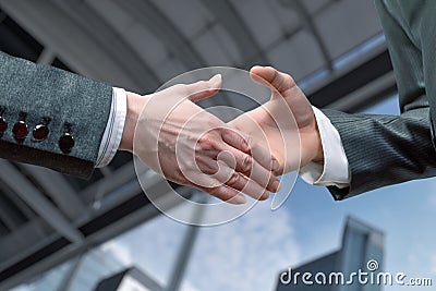 Businessmen extend their hands to each other Stock Photo