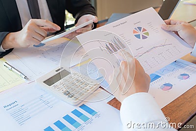 Businessmen, financial accountants, business planners, business planning ideas using computers, laptops, smat phones, and work Stock Photo