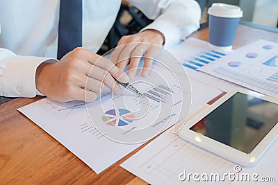 Businessmen, financial accountants, business planners, business planning ideas using computers, laptops, smat phones, and work Stock Photo