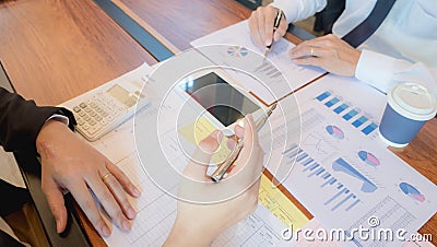 Businessmen, financial accountants, business planners, business planning ideas using computers, laptops, smat phones, and work Stock Photo