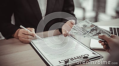 Businessmen give dollars to bribe employees in signing contracts to buy illegal land and real estate, Business fraud and social in Stock Photo