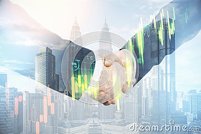 Businessmen with glowing blurry ctock chart shaking hands Stock Photo