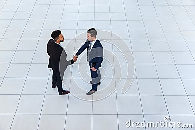 Businessmen Hand Shake Welcome Gesture Top Angle View, Two Business men Make Deal Handshake Sign Up Stock Photo