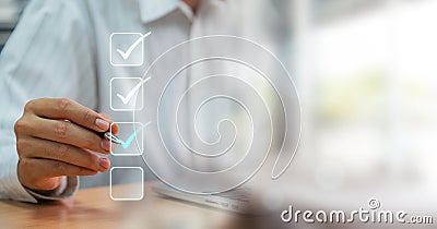 Businessmen point to tick correct sign mark in checkbox for approve quality document and project control. Excellence in document Stock Photo
