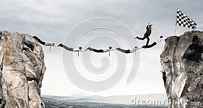 Businessmen support bridge to get to the flag. Achievement business goal concept Stock Photo