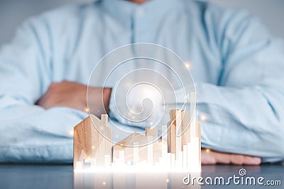 Businessmen use a handle on the wooden block to show stock graphs and rising stock signals with chart indicators. Concepts of Stock Photo