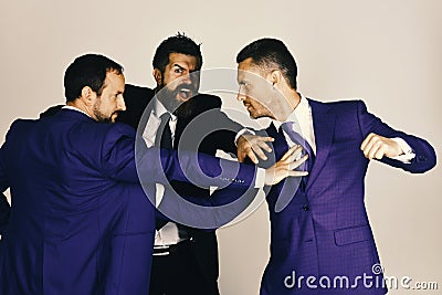 Businessmen wear smart suits and ties. CEOs fight for leadership Stock Photo