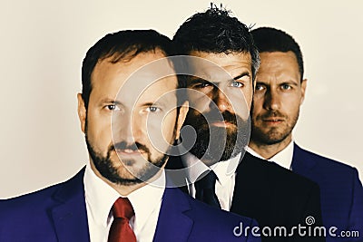 Businessmen wear smart suits and ties. Men with beards and suspicious faces stand for company leadership Stock Photo