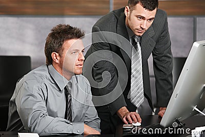 Businessmen working with computer Stock Photo