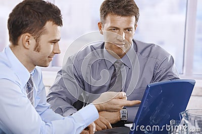 Businessmen working on laptop Stock Photo