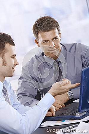 Businessmen working on laptop Stock Photo