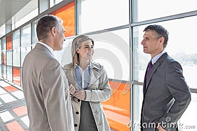 Businesspeople communicating on train platform Stock Photo