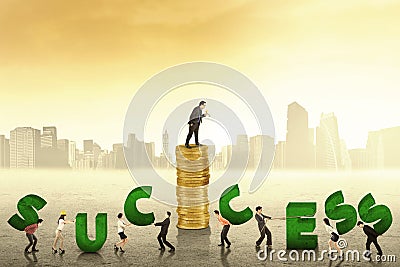 Businesspeople create a success text Stock Photo