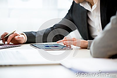 Businesspeople Discussing Business using Tablet Stock Photo