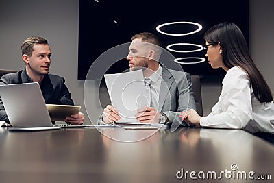 Businesspeople discussing together in conference room during meeting at office Stock Photo