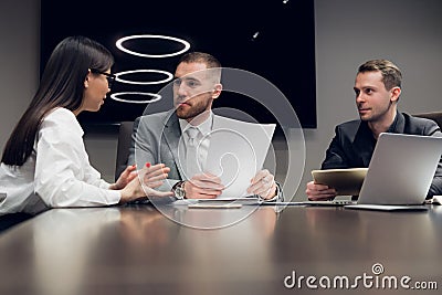 Businesspeople discussing together in conference room during meeting at office Stock Photo