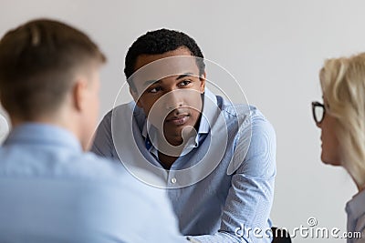 Businesspeople gathered together for negotiating focus on african businessman Stock Photo