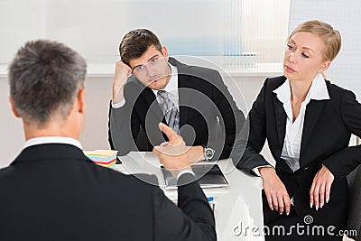 Businesspeople Having Argument At Workplace Stock Photo