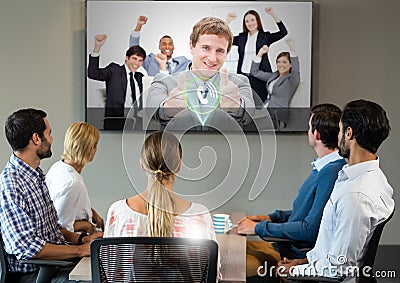 Businesspeople having video calling on television Stock Photo