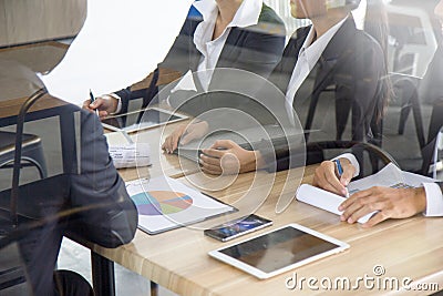 Businesspeople meeting in conferance room with paperwork Stock Photo