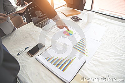 Businesspeople meeting and discussing with graph and chart and showing successful result using as background concept of Stock Photo