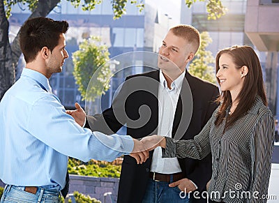 Businesspeople meeting outside of office Stock Photo