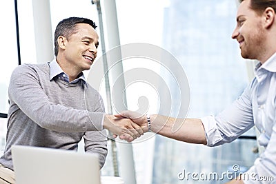 Businesspeople shaking hands Stock Photo